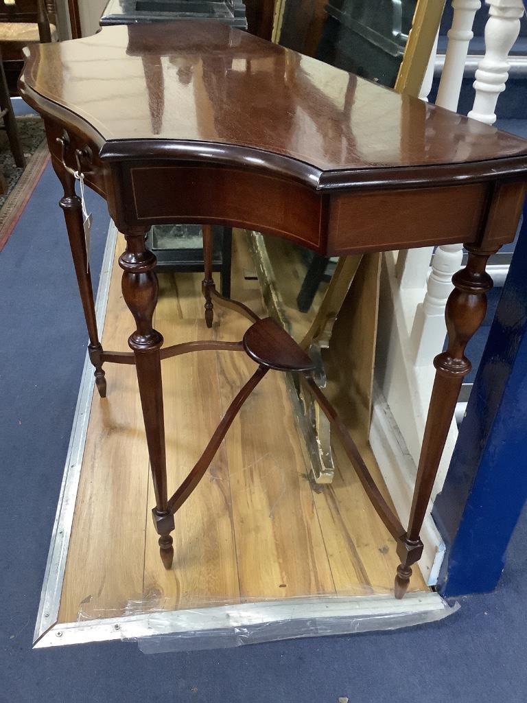 A reproduction mahogany serpentine console table, width 98cm, depth 46cm, height 73cm